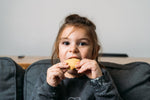 kid eating cookie